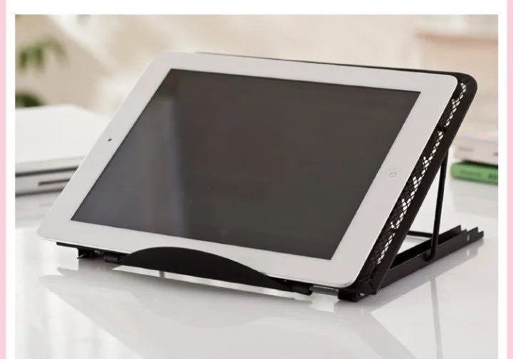 Adjustable folding laptop stand in silver, shown at an angle supporting a laptop.