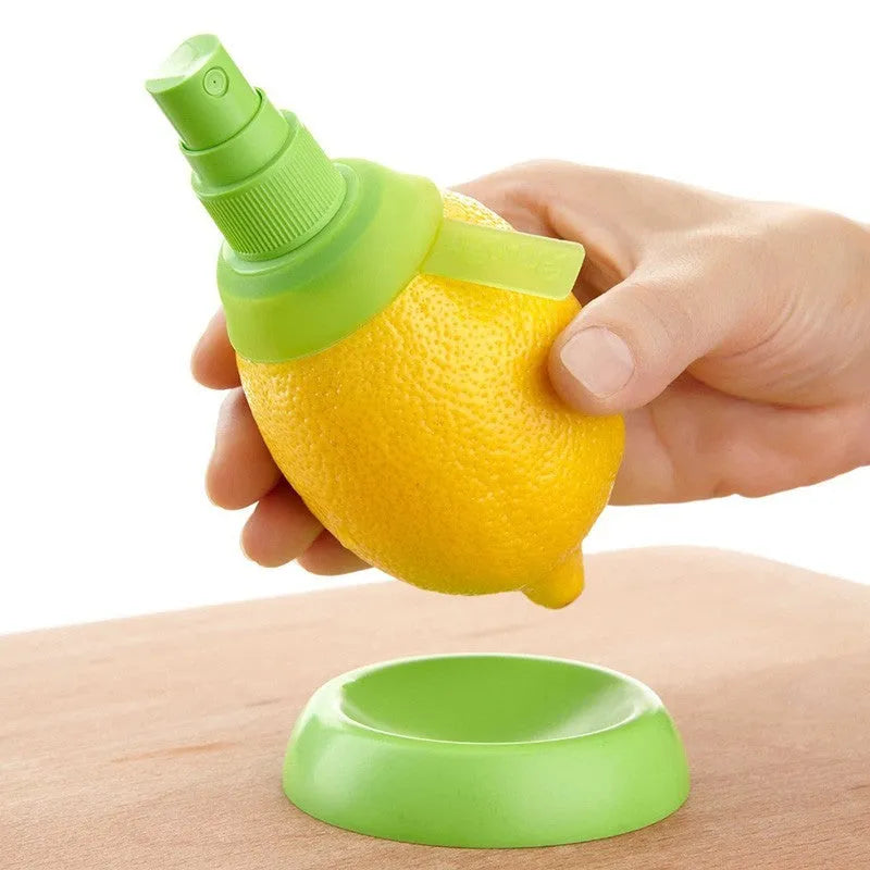 Green lemon sprayer with screw-in juicer design and PVC silicone ring at the nozzle for direct fruit juice extraction