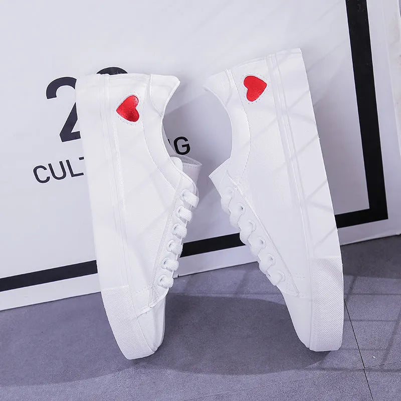 Women's PU leather heart flats shoes with colourful beads and stainless steel pendant on white background