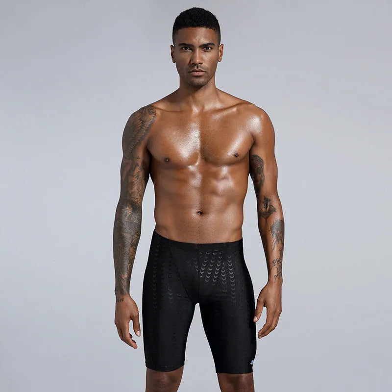 Men's solid colour shark skin texture waterproof swimming trunks for surfing, shown in sizes XL to 4XL.