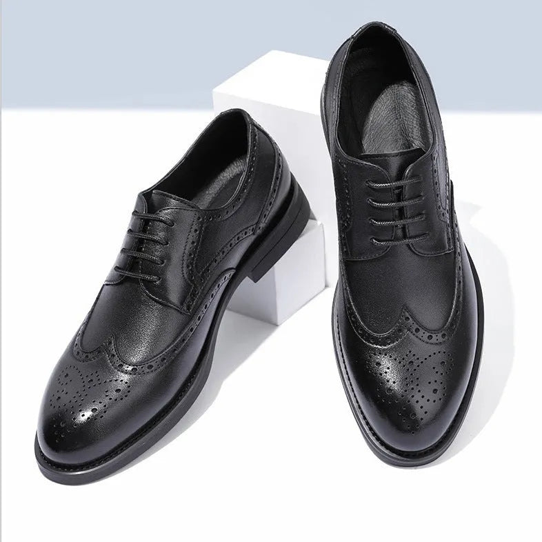 Men's black brogue leather shoes with traditional wingtip design and perforated patterns