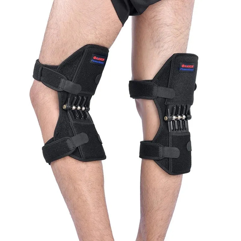 Black knee booster with carbon steel spring and Velcro straps on a neutral background