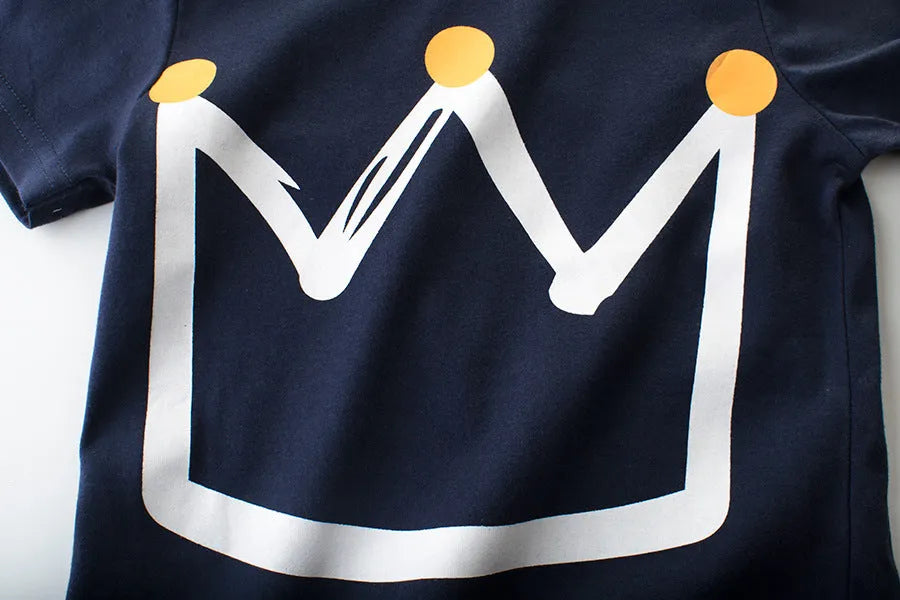 Boy wearing a royal blue short sleeve cotton T-shirt in Korean style, showing front view.