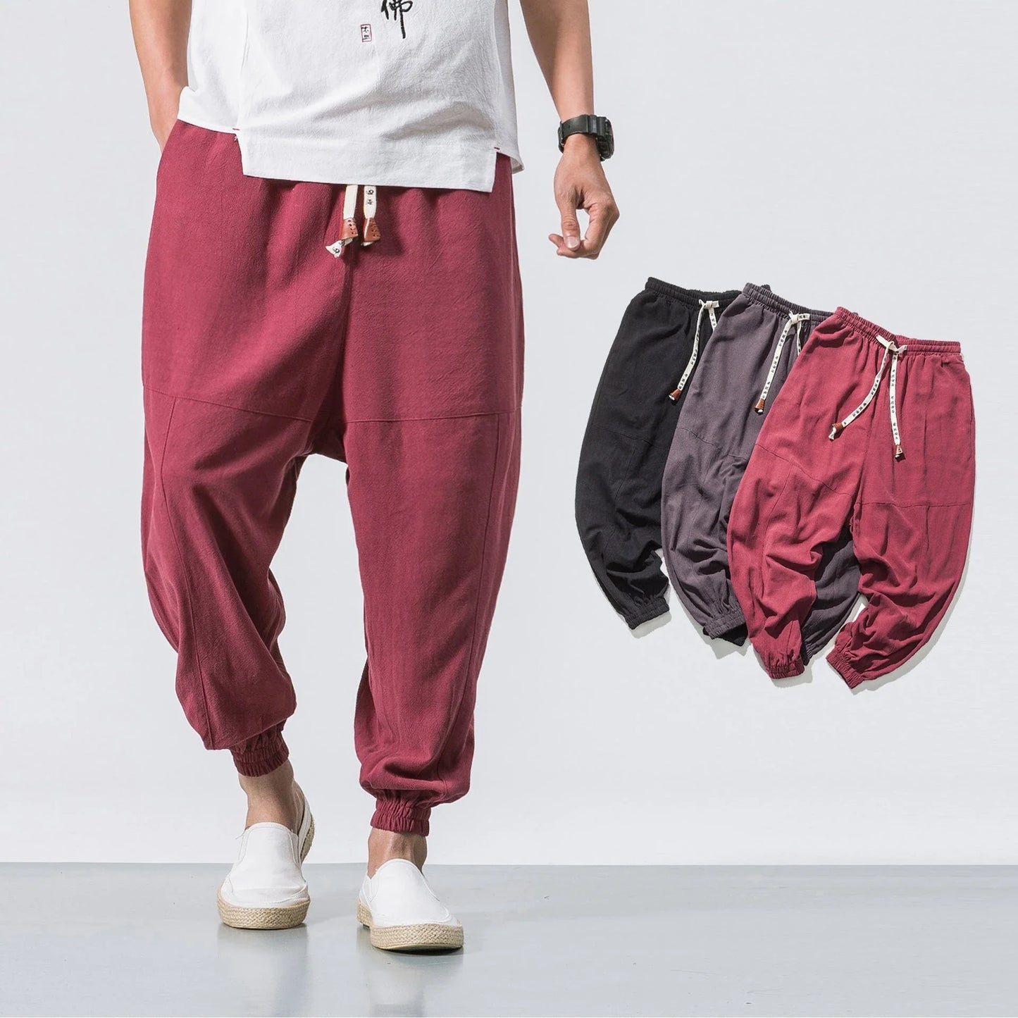 Men's cotton jogger pants with drawstring waist, side pockets, and tapered legs in various colors