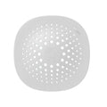 High quality TPR kitchen sink floor drain in dark grey, 145 x 145 mm, on tiled floor