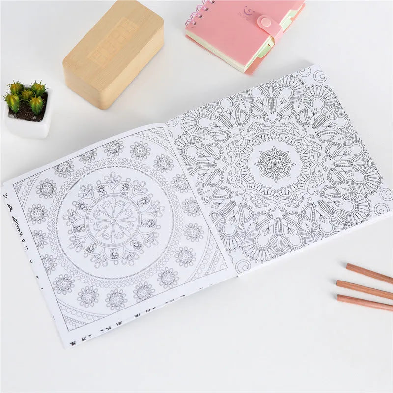Square mandala colouring book open to show geometric patterns, with soft binder cover.