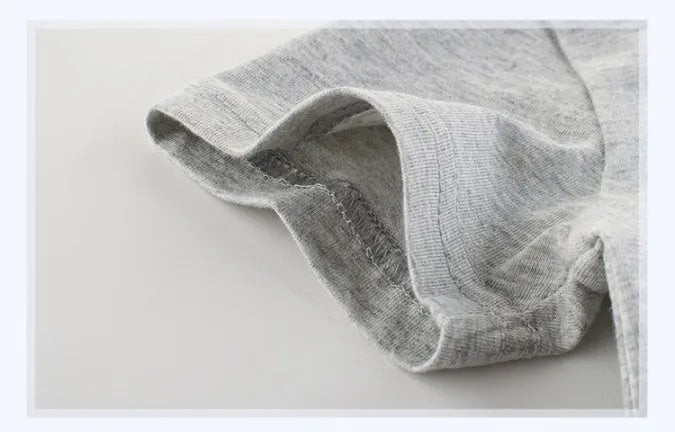 Grey cotton children's t-shirt shown with a size chart listing measurements from 90cm to 140cm.