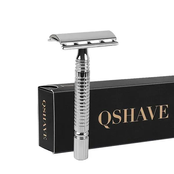 Stainless steel double-edged safety razor with storage box on a bathroom counter.