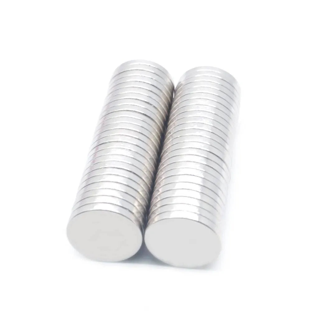 Rare earth NdFeB magnet disc 14x2mm silver N35 grade on white background