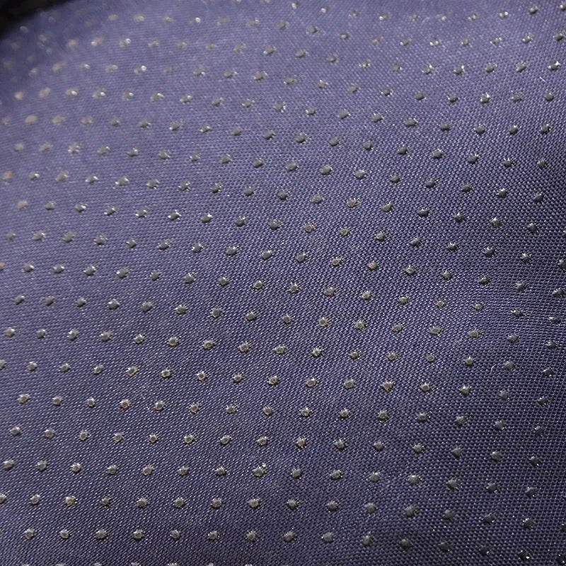 Blue enclosed cat bed with removable fleece liner, shown in a home setting.