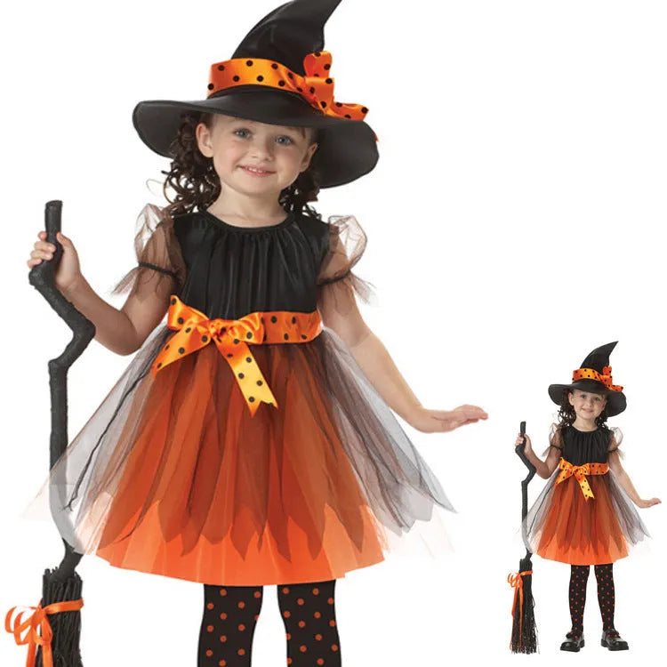 Child's purple and yellow witch costume with bat and broom designs, made from linen-blend fabric.