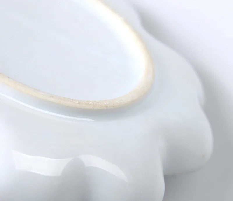 White ceramic painting palette with plum blossom design, shown in 6 inch, 7 inch, and 8 inch size options.