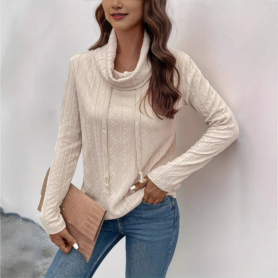 Apricot-coloured women's pullover hoodie with a drawstring hood and long sleeves laid flat.