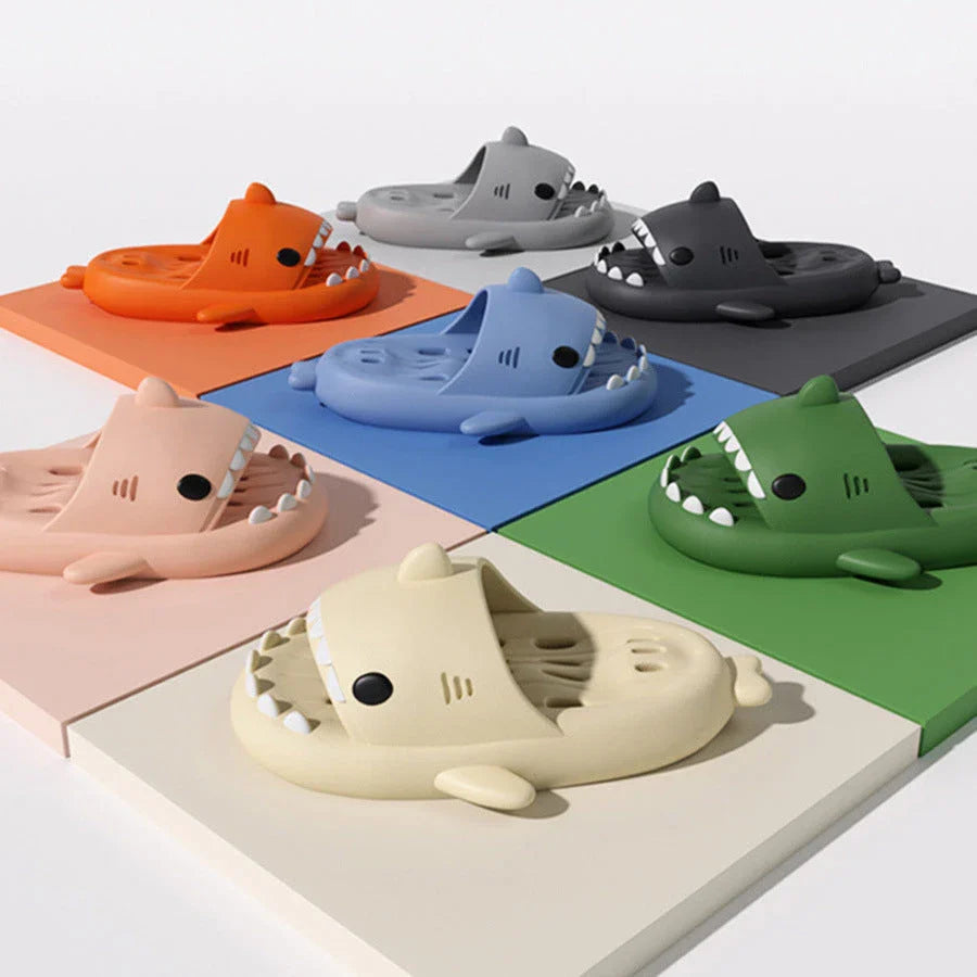 Shark-inspired shower slides with drain holes, featuring authentic shark design details and quick-drying EVA material