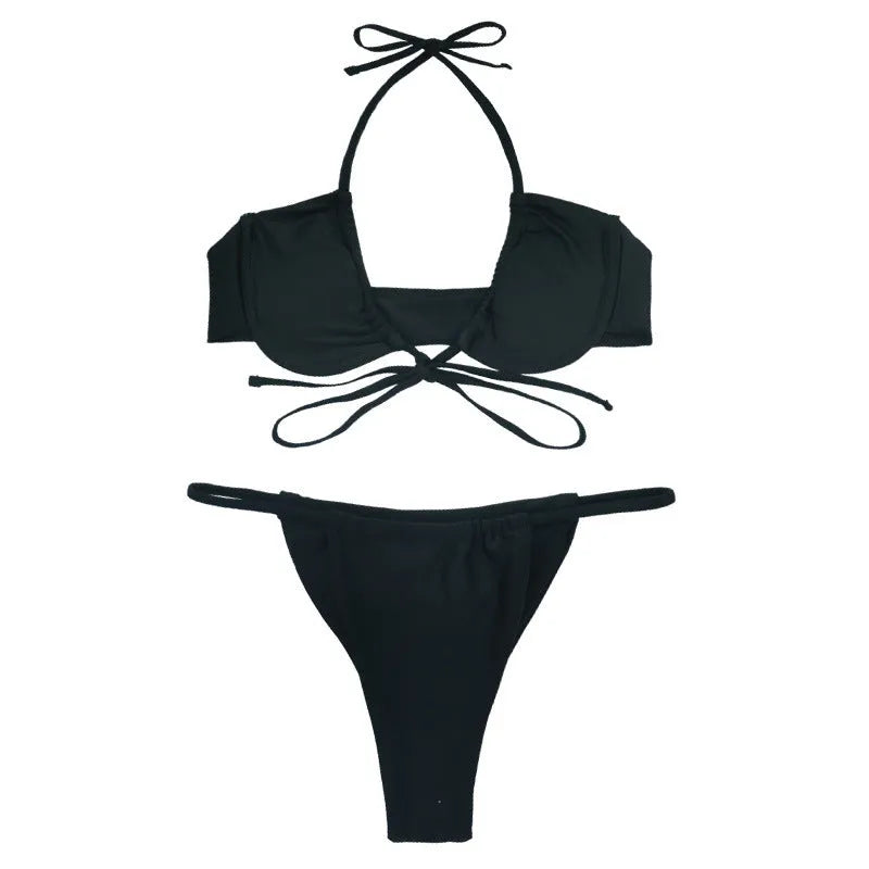 Women's two-piece black and mint green nylon bikini set on a mannequin.
