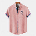 Man's loose fit linen short sleeve shirt showing ocean fish pattern detail on the lapel.