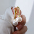 Yellow gold copper earrings with imitation pearl and inlaid zircon geometric ring design
