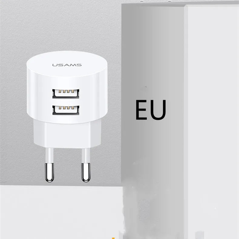 White portable universal dual USB charger with EU, UK and US adaptor heads for international travel