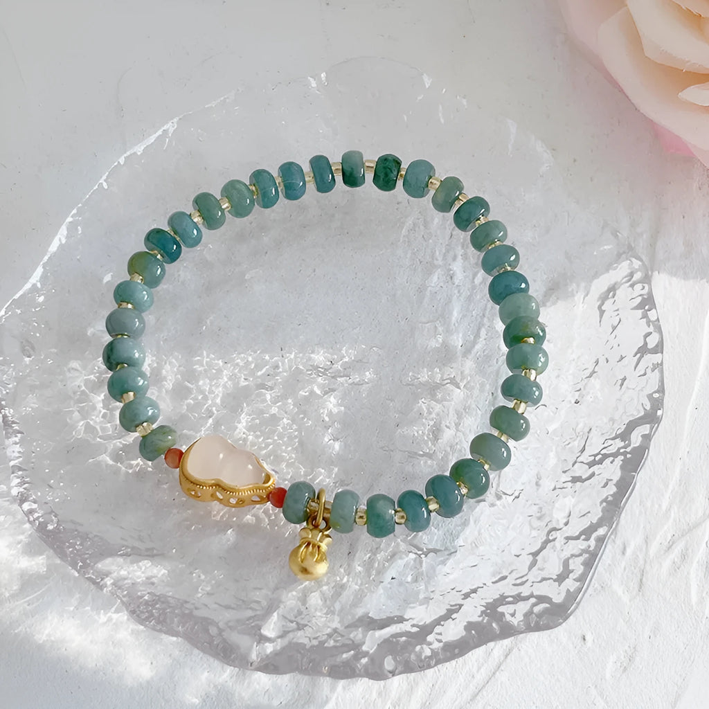 Natural blue water Hetian jade bracelet with carved gourd charm and engraved peace buckle