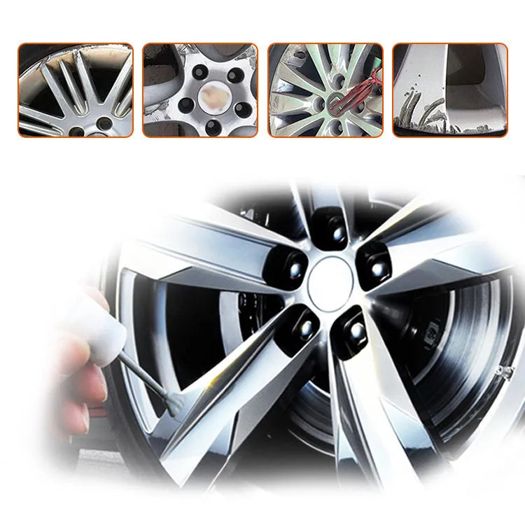 Alloy wheel repair kit with glue, paint, sanding file, gloves, spatulas and brushes on workbench