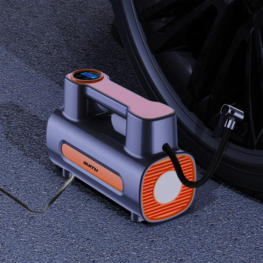 Black portable cordless tyre inflator with digital LCD screen on a grey background