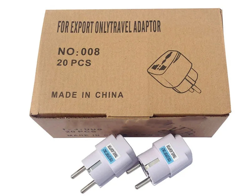 White universal travel adapter showing compatibility with AU, EU, UK, and US plug types.
