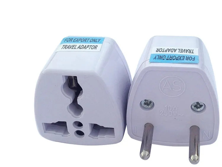 White universal travel adapter showing compatibility with AU, EU, UK, and US plug types.