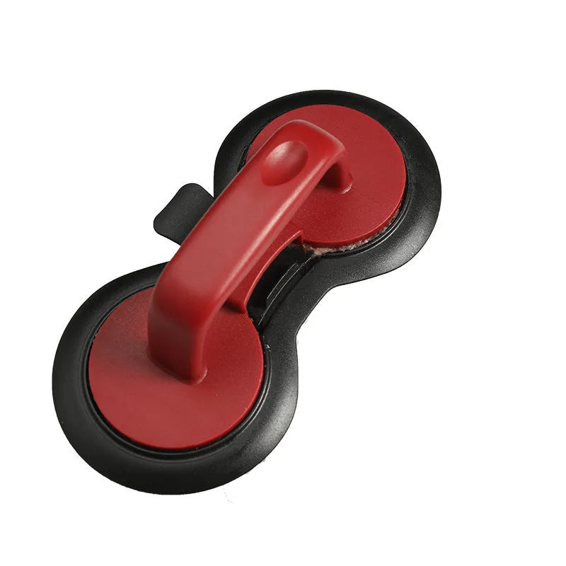 Black and red round plastic burger press for making uniform patties.