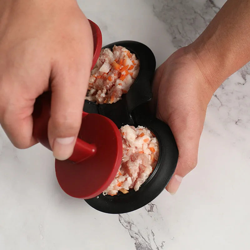 Black and red round plastic burger press for making uniform patties.