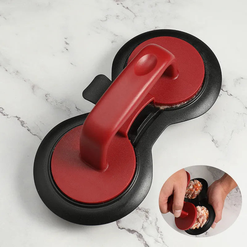 Black and red round plastic burger press for making uniform patties.