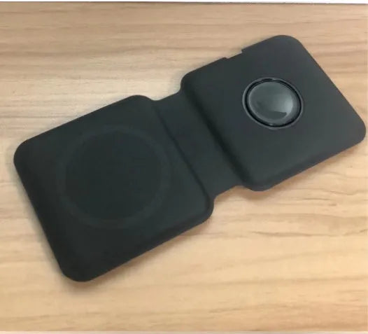 White foldable magnetic wireless charging dock showing two phones charging simultaneously.