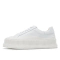 Women's black suede platform trainers with thick rubber sole and back lacing.