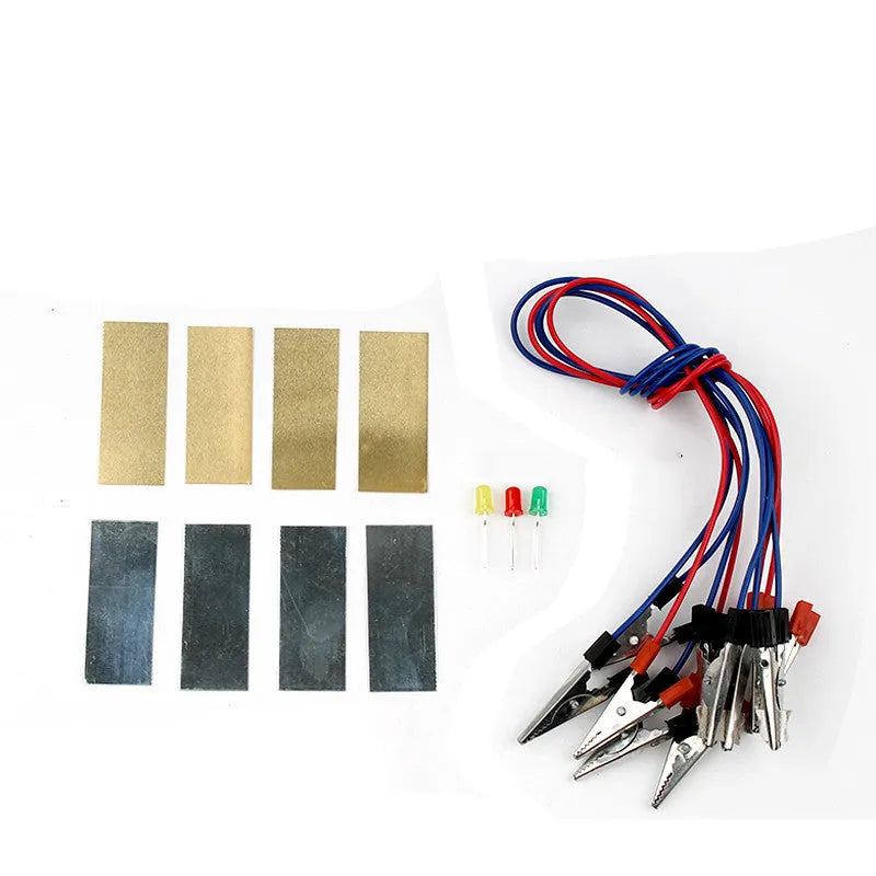 Zinc sheet copper sheet electrode assembly material for fruit battery experiment on white background