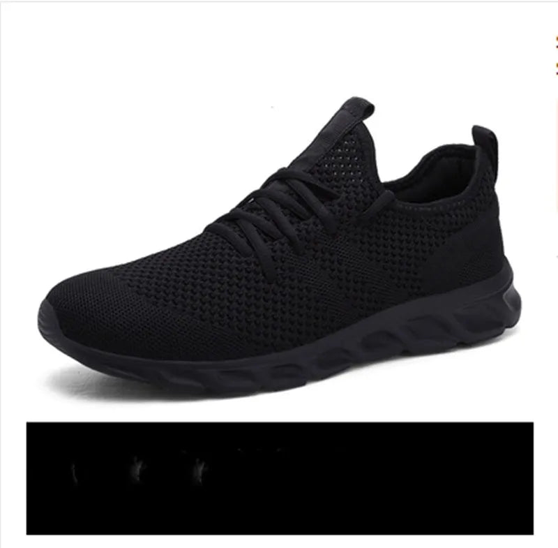 Men's black and white mesh sport sneakers with round toe and lace-up closure