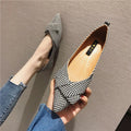 Red and black women's pointed toe flat shoes with a shallow mouth design and low flat heel.
