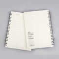 Coil-bound grid dot matrix notebook in A5 size with square ruling and PP matte cover