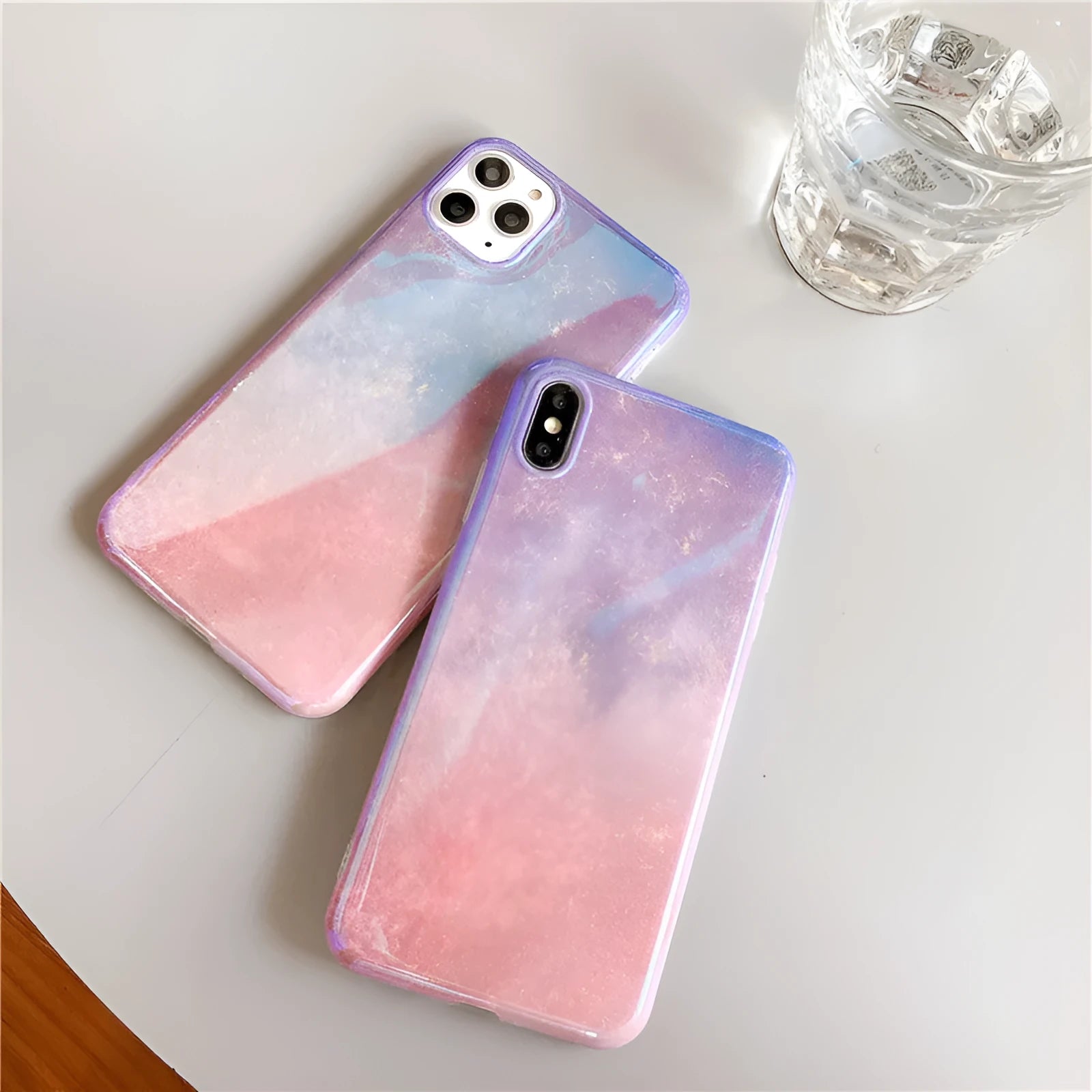 Gradient pink glitter silicone phone case compatible with iPhone models on a white background