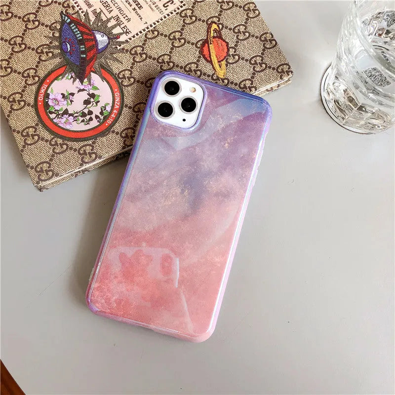 Gradient pink glitter silicone phone case compatible with iPhone models on a white background
