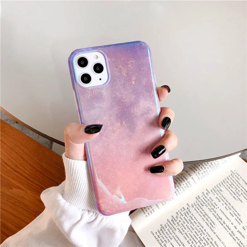 Gradient pink glitter silicone phone case compatible with iPhone models on a white background
