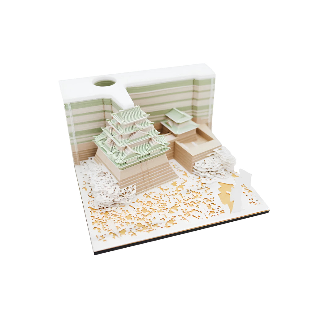 Three-dimensional specialty paper model of the Tianshou Tower from Spirited Away on a desk.