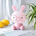 USB-powered cartoon rabbit night light with glasses details in blue, green, or pink colour options