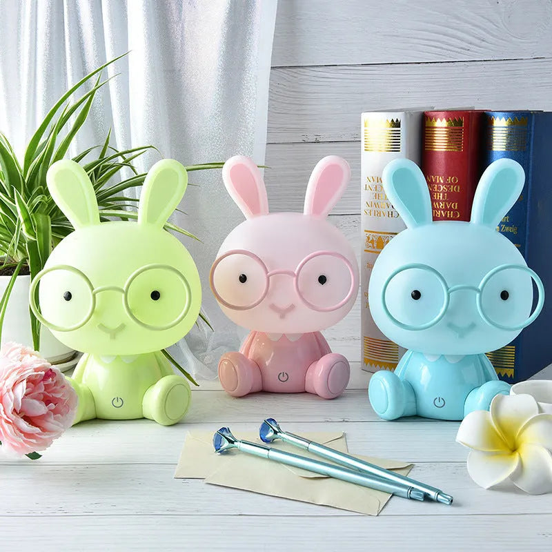 USB-powered cartoon rabbit night light with glasses details in blue, green, or pink colour options
