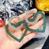 Heart-shaped alloy earrings with diamond-cut finish, 5.8cm x 4.6cm, in pink or green, 20g pair.