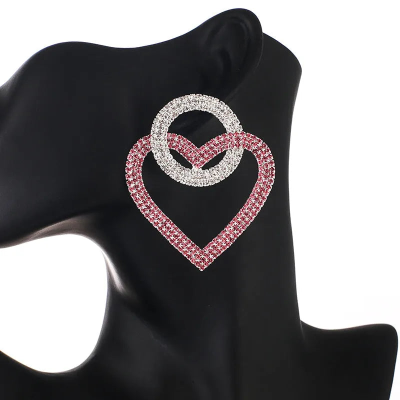 Heart-shaped alloy earrings with diamond-cut finish, 5.8cm x 4.6cm, in pink or green, 20g pair.