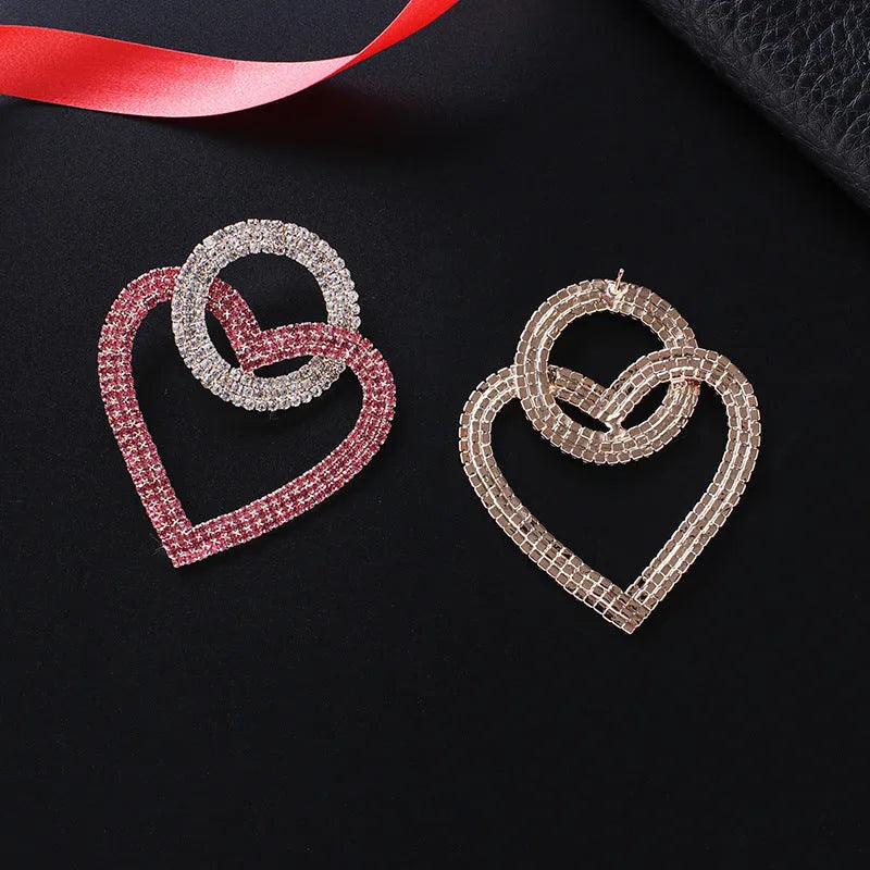 Heart-shaped alloy earrings with diamond-cut finish, 5.8cm x 4.6cm, in pink or green, 20g pair.