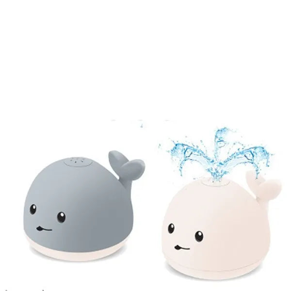 Grey and white whale bath toy spraying water with LED lights flashing