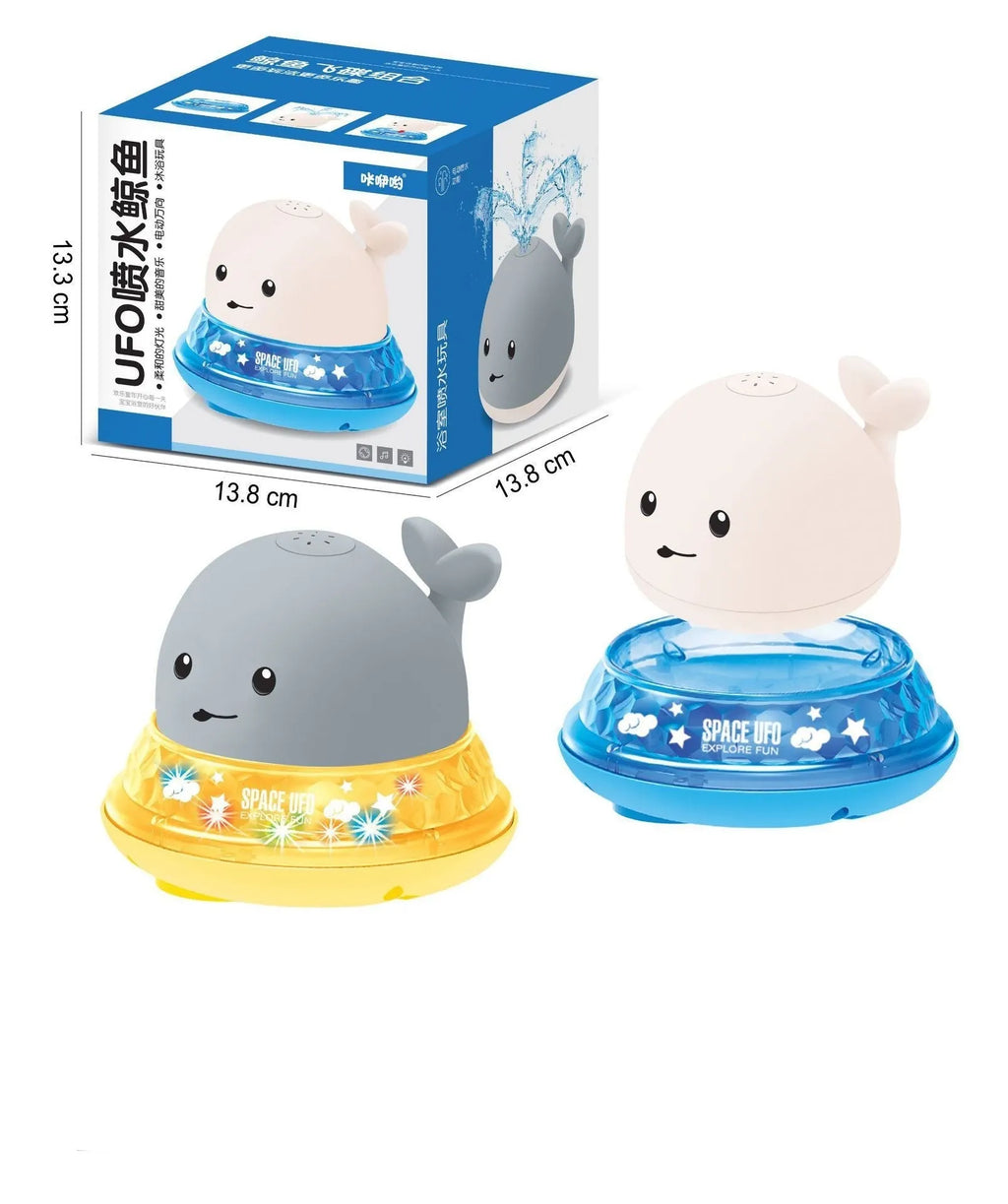 Grey and white whale bath toy spraying water with LED lights flashing