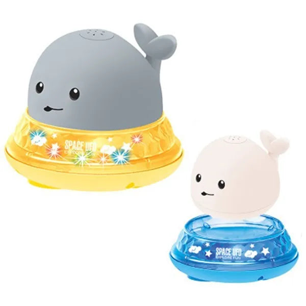 Grey and white whale bath toy spraying water with LED lights flashing