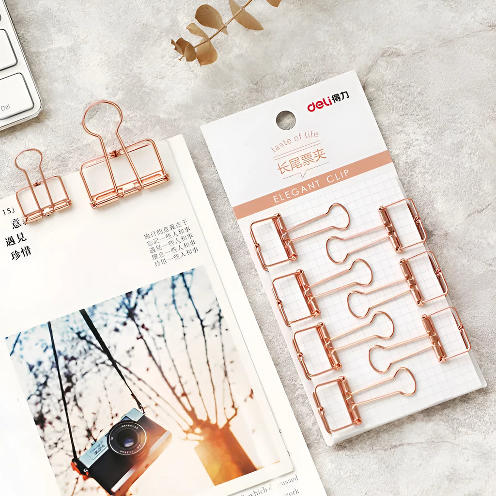 Rose gold metal binder set showing small and large binders for ticket and document storage