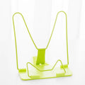 Multifunctional metal and plastic reading frame in blue colour on a desk holding a book upright.